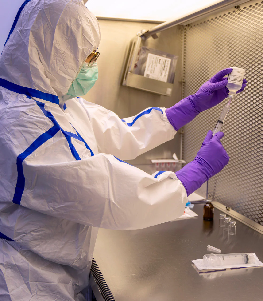 Town & Country pharmacist in sterile cleanroom gear compounding ophthalmic medication